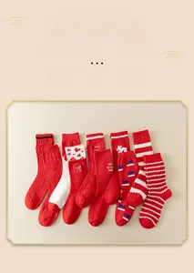Detailed flat lay of red cotton crew socks with festive stripes and cute bunny patterns
