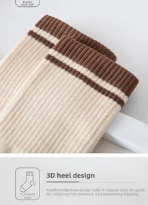 Detail of ribbed knit cotton socks featuring brown stripes and a reinforced Y-heel