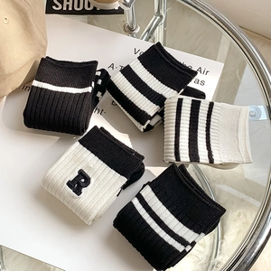 Minimalist black and white striped cotton socks with R embroidery in casual style