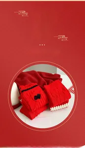 Detailed knit texture of thick red cotton socks with space heart patch and wavy cuffs