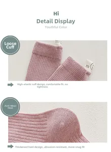 Detail of pink cotton crew sock featuring elastic ribbed cuff and GOOD LUCK fabric label