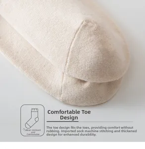 Close-up of beige cotton socks with reinforced toe design and imported stitching details