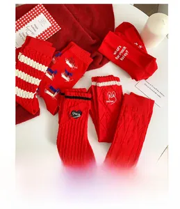 Detailed set of red cotton crew socks featuring festive rabbit and heart patterns