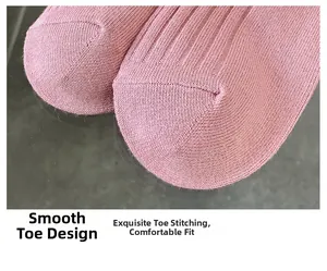 Macro view of flat toe seam on pink ribbed bamboo cotton socks for a comfortable fit