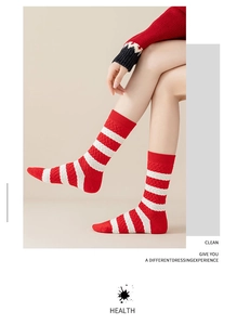 Close-up of red and white striped cotton crew socks with premium cable knit texture