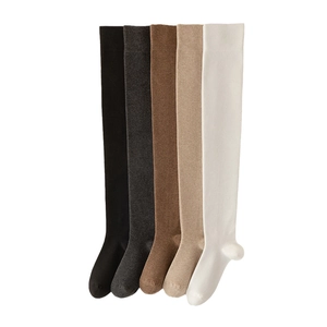 Thigh high cotton knit socks in five colors including black grey and beige on white background
