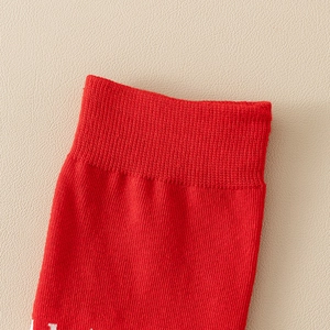 Red cotton crew socks with ribbed cuffs and striped cartoon rabbit design for women