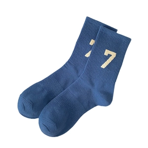 Dark blue mid-calf athletic socks with ribbed texture and yellow number 7 design