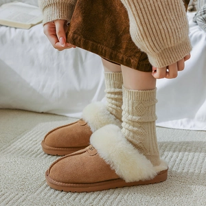 Brown suede winter slippers with warm faux wool lining and non-slip rubber soles