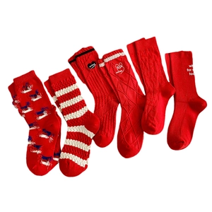 Set of six red mid-calf cotton socks with various patterns and embroidery for women