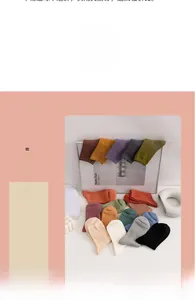 Detailed close-up showing various colors of ribbed cotton socks with knit texture