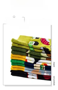 Close-up of colorful mid-calf cotton socks featuring diverse cartoon patterns and Y-heel design
