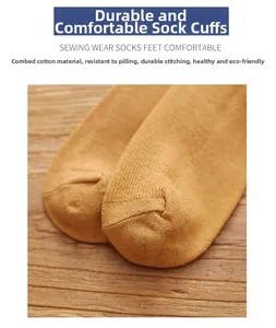 Detailed close-up of durable hand-sewn toe seam on mustard yellow combed cotton socks
