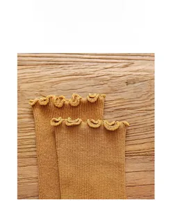 Detail of caramel ruffled cuff socks showing exquisite double-needle knitting technology