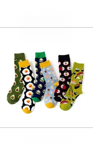 Detail of cotton crew socks showing fruit and food prints like avocado and sushi