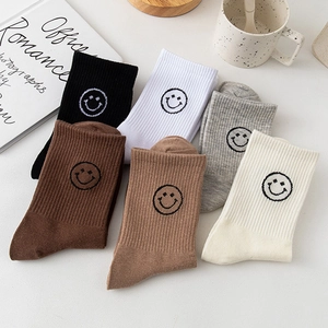 Set of 6 high cotton crew socks in neutral colors featuring embroidered smiley faces