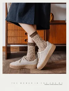 Detail of wool socks with 3D bear jacquard and thick gum sole suede sneakers