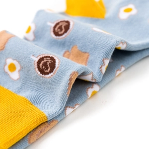 Cotton crew socks with cute egg and coffee cup patterns on a light blue base
