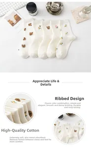 Close-up of premium cotton socks with cute bear embroidery and ribbed cuff details