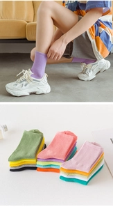 Detail view of colorful ribbed cotton crew socks in vibrant candy colors for women