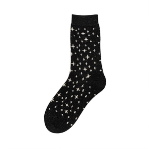 Thick wool socks for women featuring white star patterns on black knitted fabric