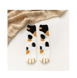 Detailed macro view of soft coral fleece cat paw socks with thick thermal plush texture