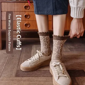 Thick wool socks for women featuring cute white bear jacquard patterns in warm brown
