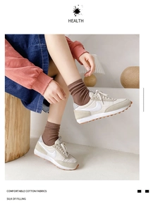 Brown cotton crew socks paired with vintage beige sneakers for a stylish daily look