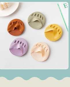 Macro detail of breathable five-toe forefoot pads in five pastel macaron colors