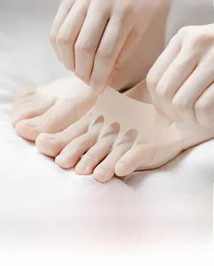 Close-up of beige five-toe forefoot pads showing high elasticity and seamless fit for heels