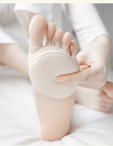 Close-up of skin-colored forefoot pads on feet for pain relief and shock absorption