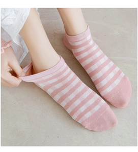 Detail of pink and white striped cotton sock showing elastic cuff stretch and texture