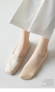 Macro detail of seamless ice silk invisible sock worn with stylish beige square toe flat shoe