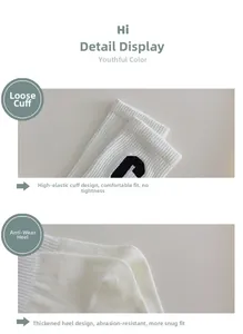 Detailed view of elastic ribbed cuff and reinforced heel of white cotton socks with C logo