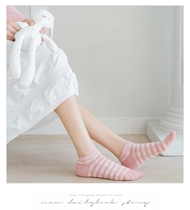 Detailed view of pink and white striped ankle socks with cute Japanese style knit design