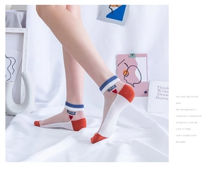 Close-up of cotton socks with Lovely embroidery, orange accents and blue striped cuffs