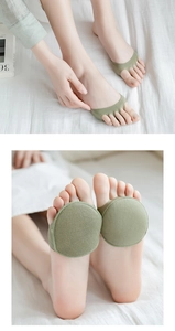 Detail of light green toe-separating forefoot pads for high heel cushioning and comfort
