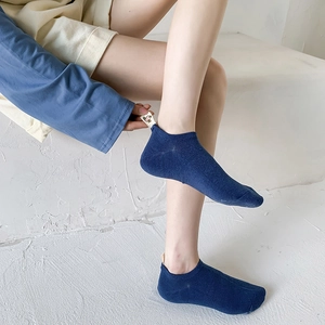 Navy blue low-cut cotton socks featuring a stylish bear back tab and knit texture