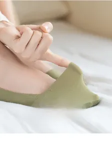 Close-up of olive green low cut sock showing high elasticity and fine knit texture