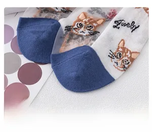 Macro detail of the reinforced blue toe stitching on a white cartoon cat sock