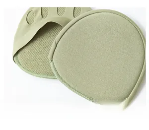 Close-up of light green forefoot pad showing textured knit fabric and toe openings