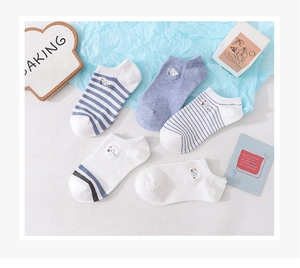 Detailed view of low cut socks with cute sheep embroidery and striped cotton patterns
