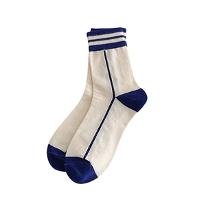 Navy blue striped crew socks in vintage college style with athletic ribbed cotton texture