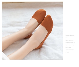 Detail of caramel low-cut invisible sock on foot showing snug fit and seamless edge