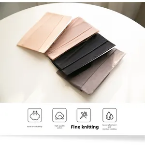 Detailed knit texture of breathable cotton tights in skin, black, and grey tones