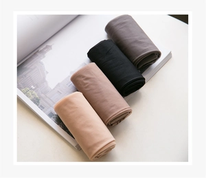 Flat lay of sheer velvet pantyhose in light nude, deep tan, black, and grey-brown colors