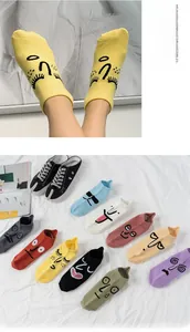 Detail of colorful cartoon face ankle socks with high-elastic cuffs in multiple colors