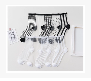 Flat lay of transparent mesh socks set with stripes and checkered patterns