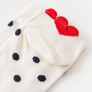 Polka dot low cut socks for women with red wavy ruffled cuffs and knitted details