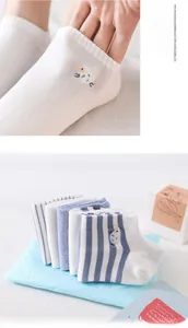 Detail of high-elasticity ribbed cuffs and cute sheep embroidery on cotton socks